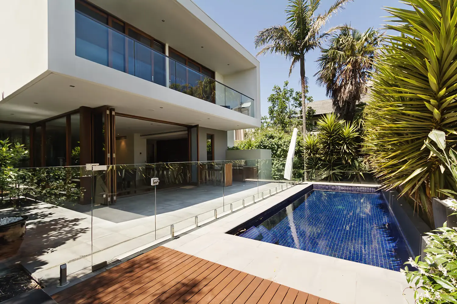 Frameless glass pool fencing and balcony balustrade at a Sydney home